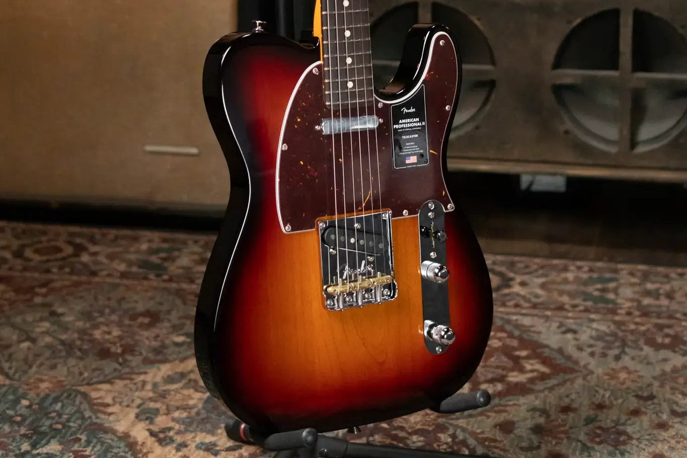 Electric Telecaster guitar on a stand with a blurred background