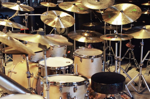 Acoustic Drum Set surrounded with cymbals